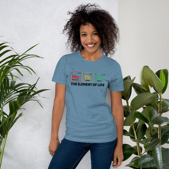 Light blue unisex t-shirt with "Mother - the Element of Life" design, worn by model, plant background.