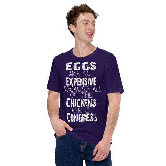 Unisex t-shirt with text "Eggs are so expensive because all of the chickens are in Congress," navy blue, worn by a person.