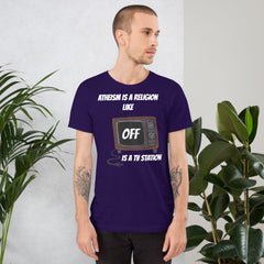White unisex t-shirt with "Atheism is a religion like OFF is a TV station" design.