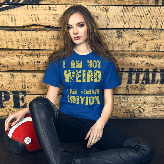 Unisex t-shirt with "I Am Not Weird" yellow text, blue color, worn by model.