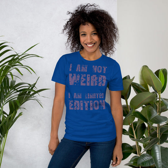 Unisex t-shirt with "I am not Weird, I am a Limited Edition" in purple text, worn by a person.