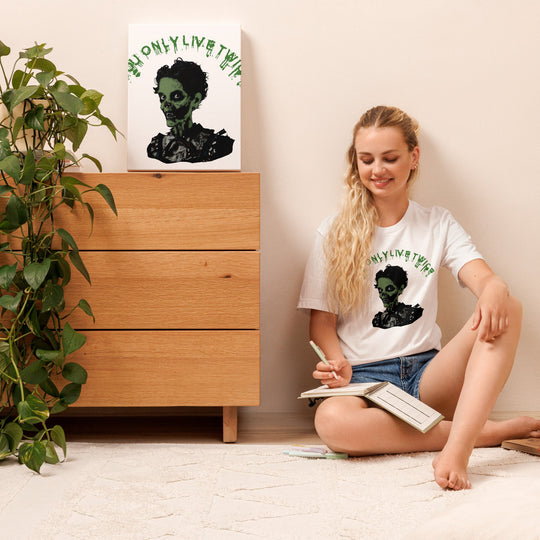 You only live twice vintage zombie unisex t-shirt with bold graphic print, worn by person sitting on floor.