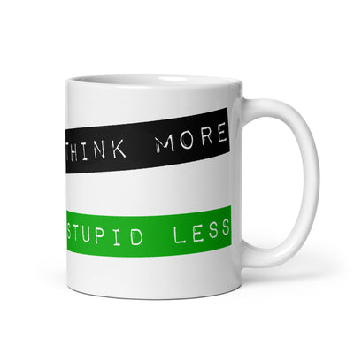White glossy ceramic mug featuring a vintage-style green and black embossed tape design that reads 'THINK MORE STUPID LESS'.