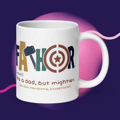 White ceramic mug with "Fathor - Like a dad, but mightier" printed on it, sturdy and glossy, dishwasher and microwave safe.
