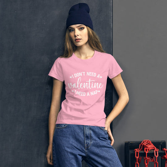 Women's pink t-shirt with "I Don't Need a Valentine I Need a Nap" quote, casual fashion.