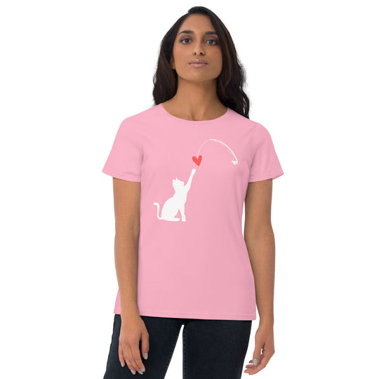 Woman wearing a pink t-shirt with a white cat and red heart design.