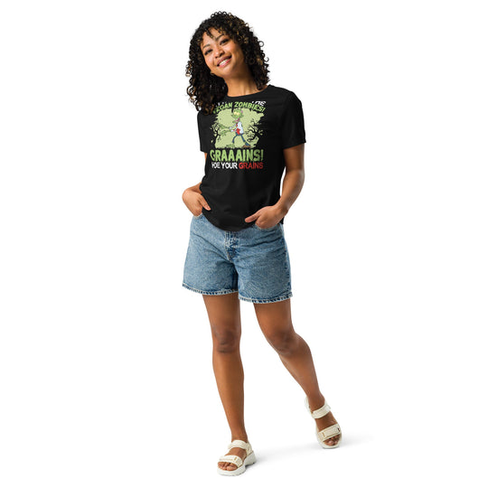 Woman wearing "Attack of the Vegan Zombies" relaxed t-shirt, black with graphic print, paired with denim shorts.